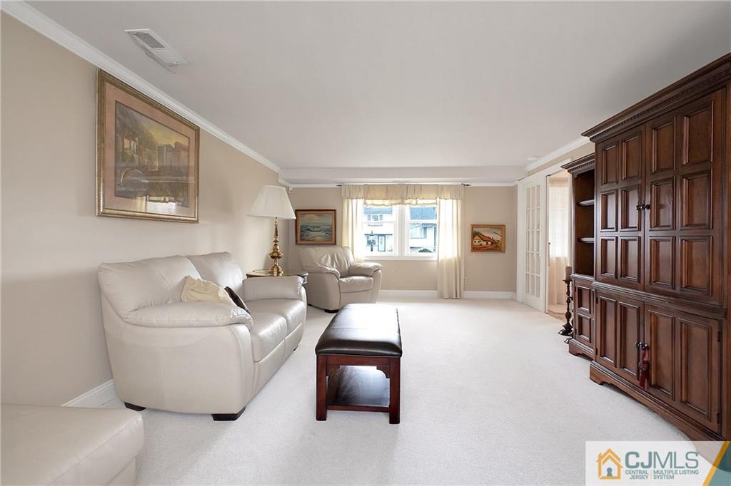 6 Meyer Road Edison, NJ 08817 - Photo 22 of 32 a living room with furniture and a window