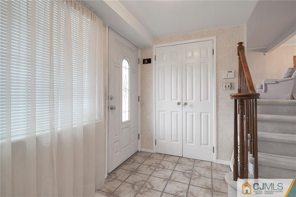 6 Meyer Road Edison, NJ 08817 - Photo 5 of 32 a view of an entryway with a window