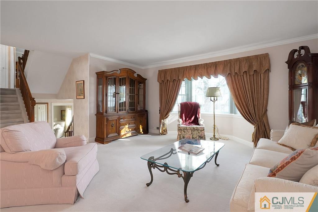 6 Meyer Road Edison, NJ 08817 - Photo 7 of 32 a living room with furniture and a wooden floor
