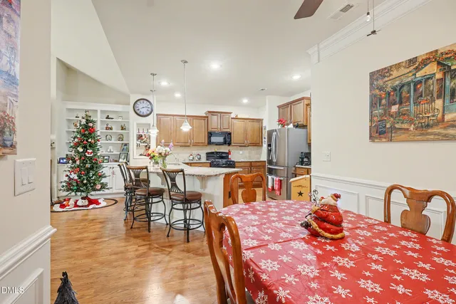 a kitchen with a table and chairs in it