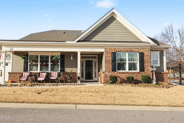 a front view of a house with a sitting space