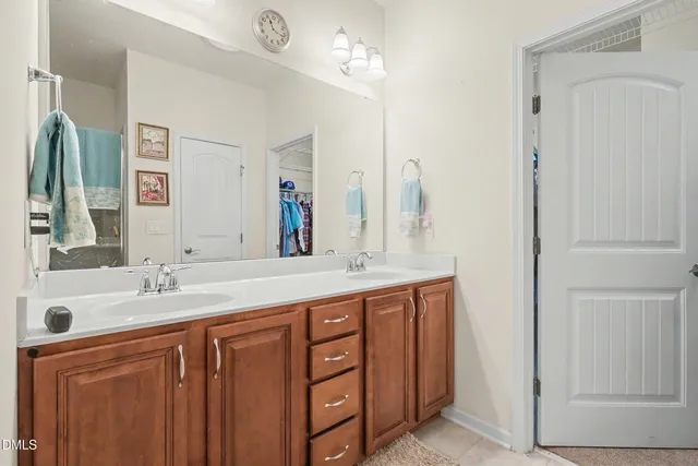 a bathroom with a shower and a sink