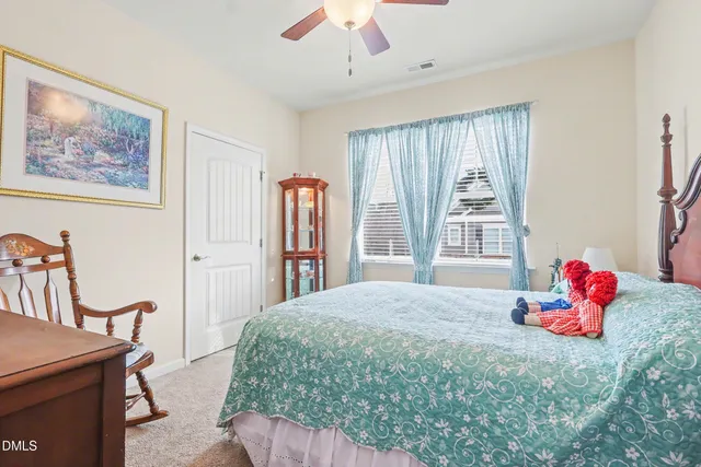 a bedroom with a bed and a closet