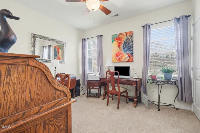 a work room with furniture and a window