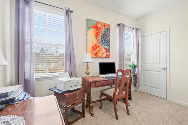 a bedroom with a bed and a desk