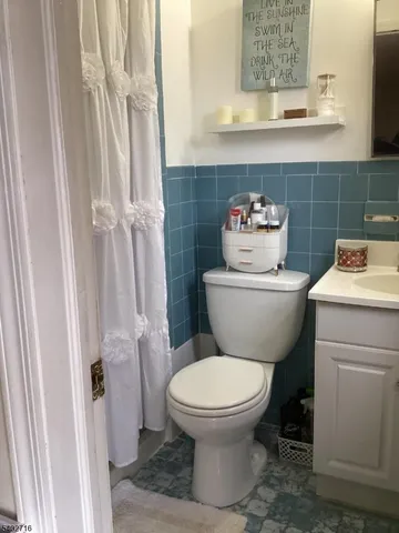 a bathroom with a toilet and a sink