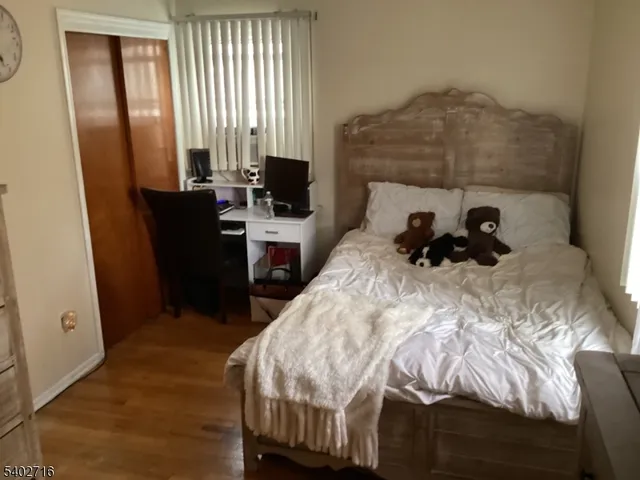 a bedroom with a bed and a fireplace