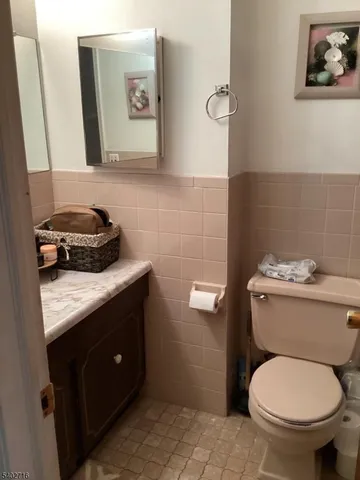 a bathroom with a toilet and a sink