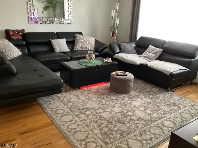 a living room with furniture and a rug