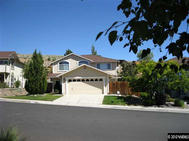 625 Talus Way Reno, NV 89503 - Photo 1 of 13 a front view of a house with a yard and garage