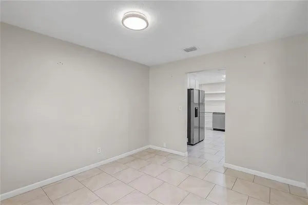 a view of a livingroom with a ceiling fan and window
