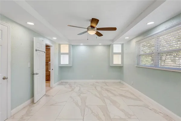 a view of an empty room with a window