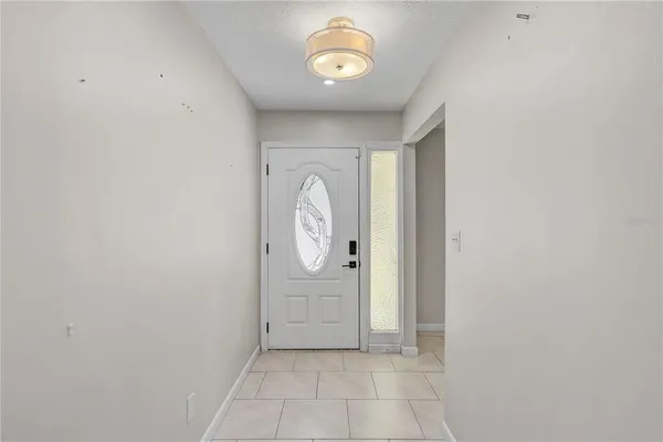 a view of a hallway with front door