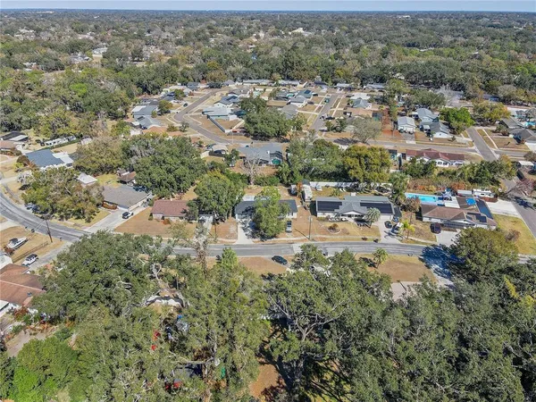 an aerial view of residential houses with outdoor space