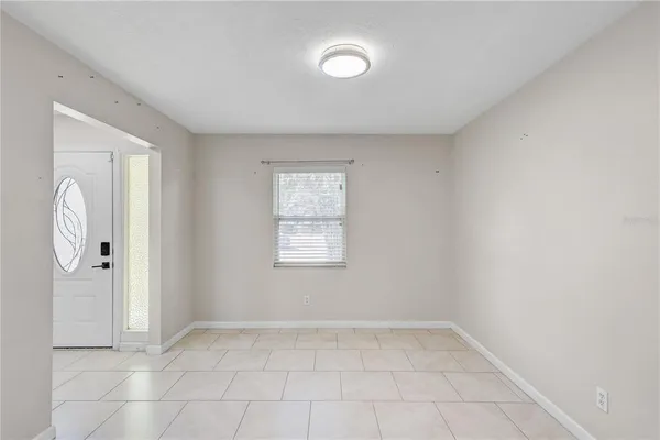 a view of a kitchen with a sink and a refrigerator