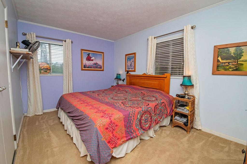 202 Argonaut Road St. Augustine, FL 32086 - Photo 18 of 33 a bedroom with a bed and a window