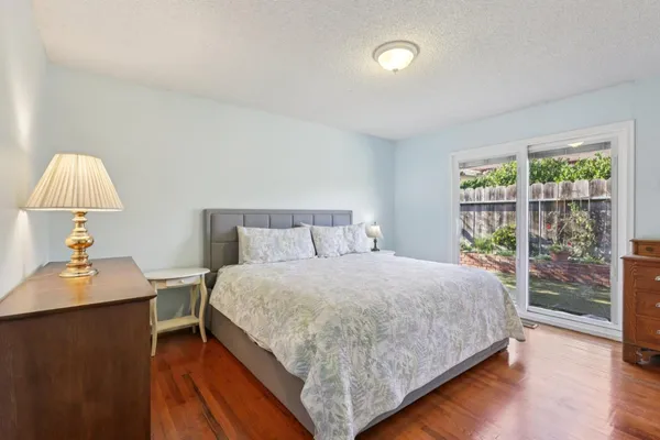 a bedroom with a bed and a table