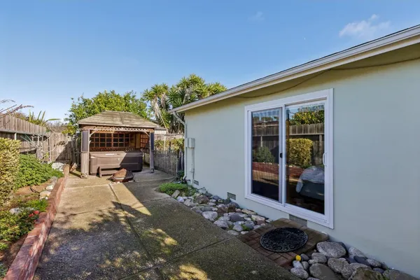a front view of a house with outdoor seating