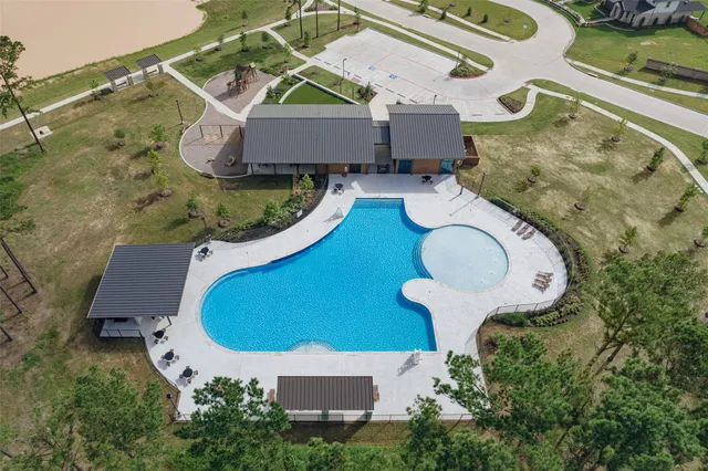 a swimming pool with outdoor seating and outdoor seating