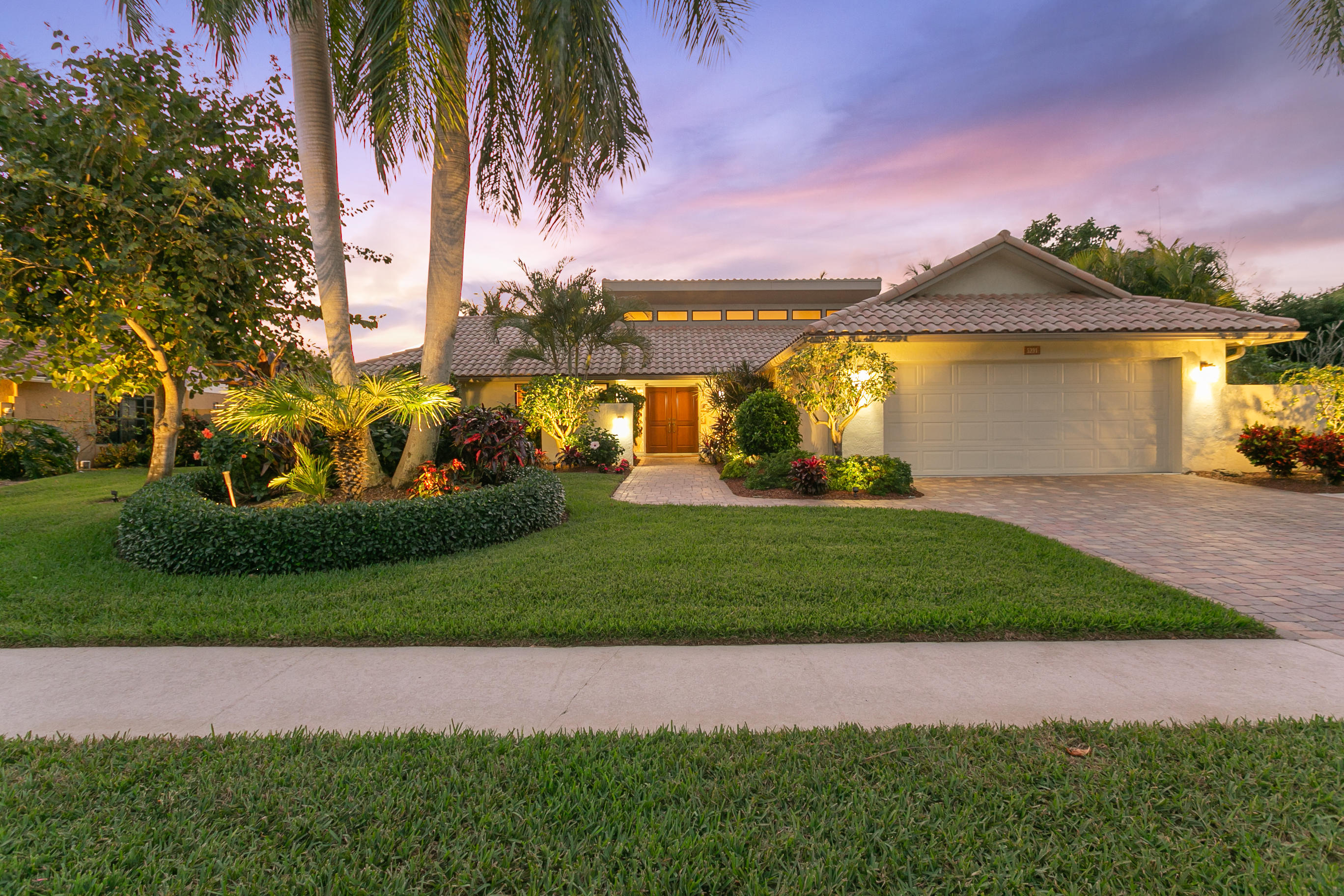 5291 Northwest 3rd Terrace Boca Raton, FL 33487 - Photo 1 of 53 FRONT VIEW OF PROPERTY AT DUSK...