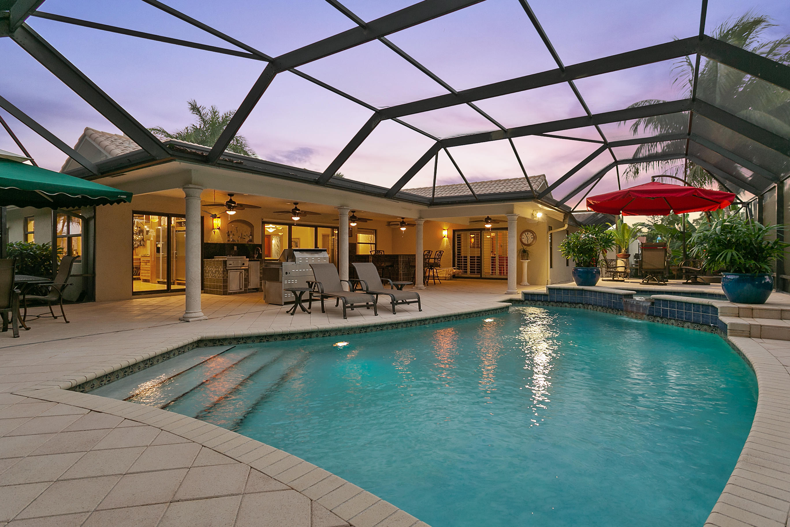 5291 Northwest 3rd Terrace Boca Raton, FL 33487 - Photo 36 of 53 DUSK VIEW OF POOL/PATIO AREA...