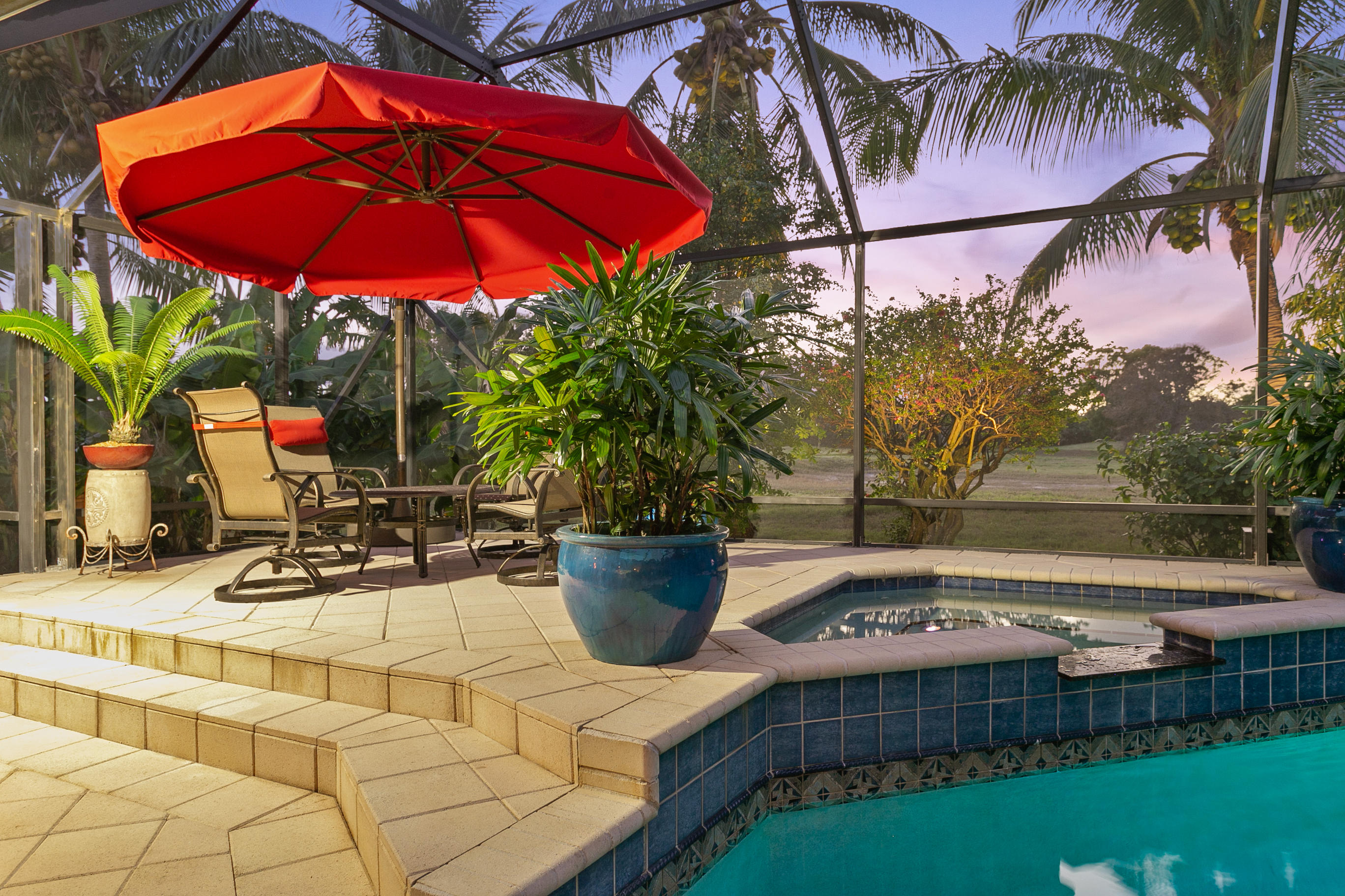 5291 Northwest 3rd Terrace Boca Raton, FL 33487 - Photo 37 of 53 DUSK VIEW OF POOL AREA....