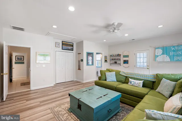 a bathroom with a sink a toilet and a window