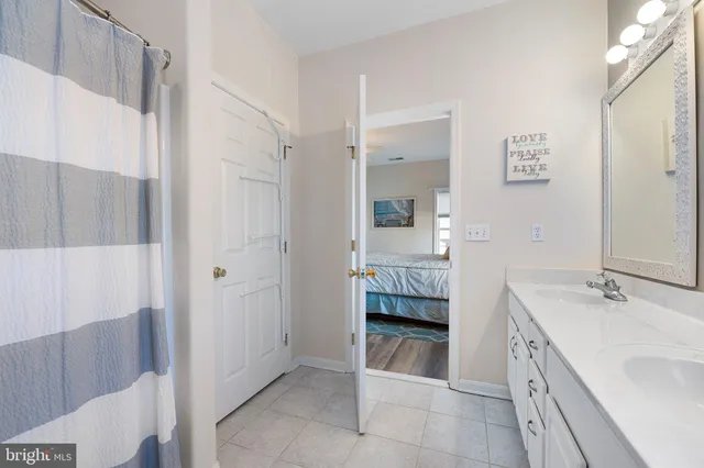 a view of walk in closet with clothes