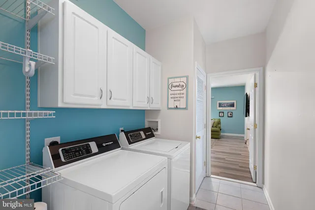 a view of a house with backyard and porch