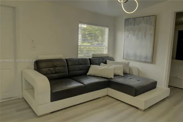 a living room with furniture and a window