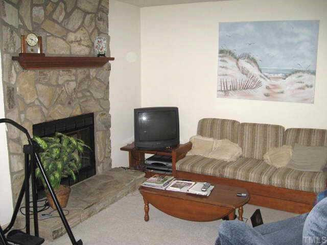 4515 Still Pines Drive Raleigh, NC 27613 - Photo 4 of 12 Second view of living room showing stone fireplace Other