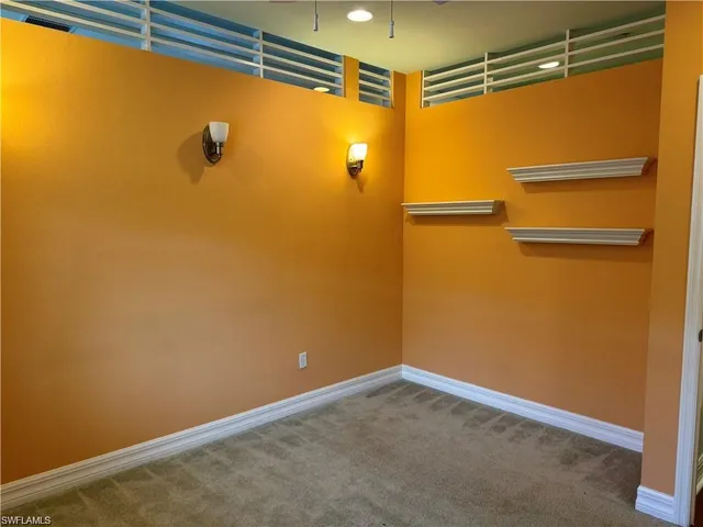 a view of a room with racks on the wall