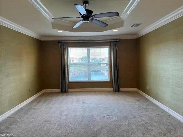 an empty room with a empty space and a ceiling fan