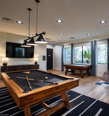 a view of a studio with wooden floor