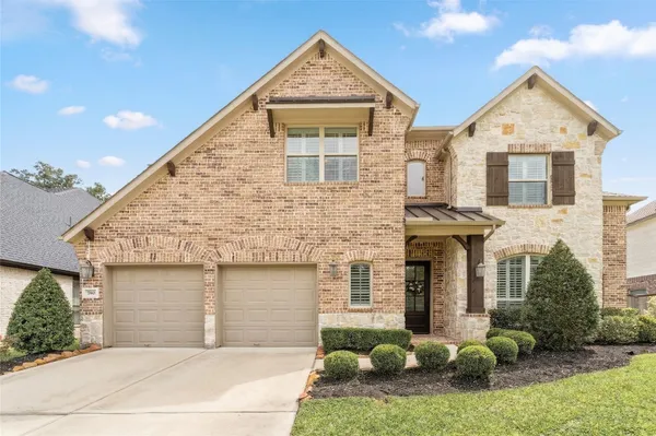 a kitchen with stainless steel appliances granite countertop a sink a stove and a wooden floors