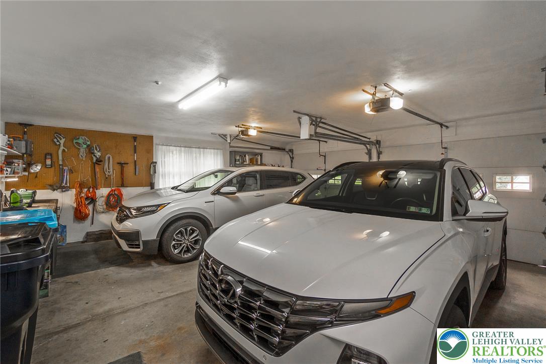 525 Wedgewood Road Bethlehem, PA 18017 - Photo 47 of 61 A well-lit garage offers a built-in workbench & car charging area for added convenience.