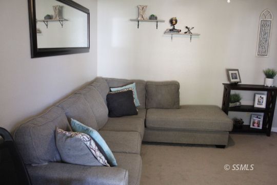 401 Ashton Street Ridgecrest, CA 93555 - Photo 6 of 36 a living room with furniture and a couch