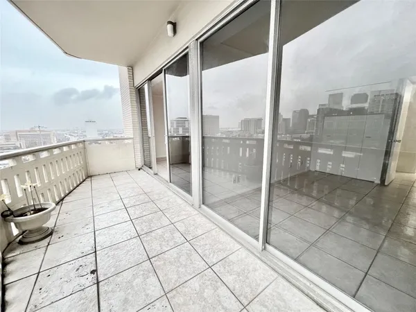 a view of a balcony with city view