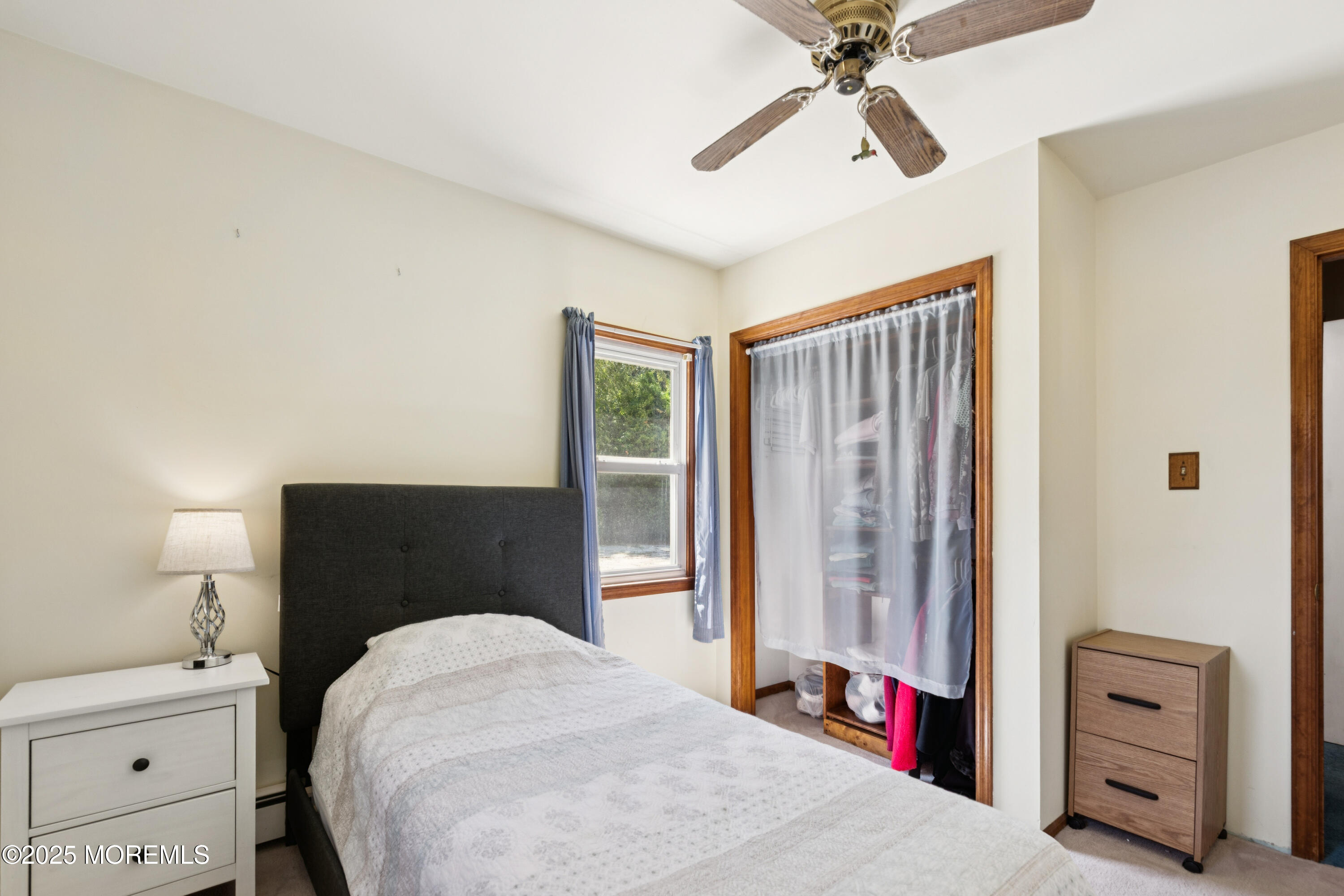 507 Riverside Drive South Brick, NJ 08723 - Photo 18 of 30 a bedroom with a bed and a chandelier