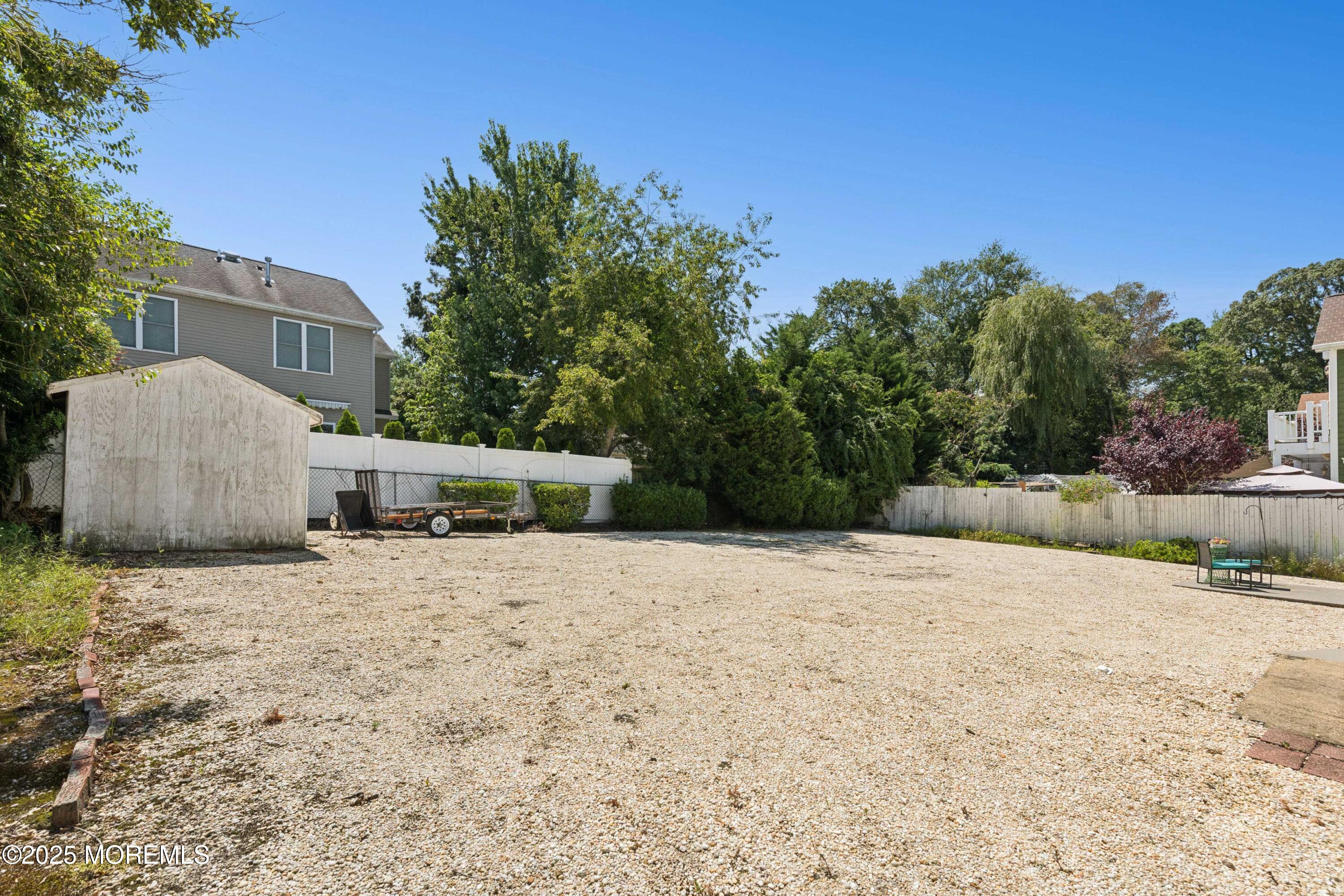 507 Riverside Drive South Brick, NJ 08723 - Photo 27 of 30 a backyard of a house with lots of green space