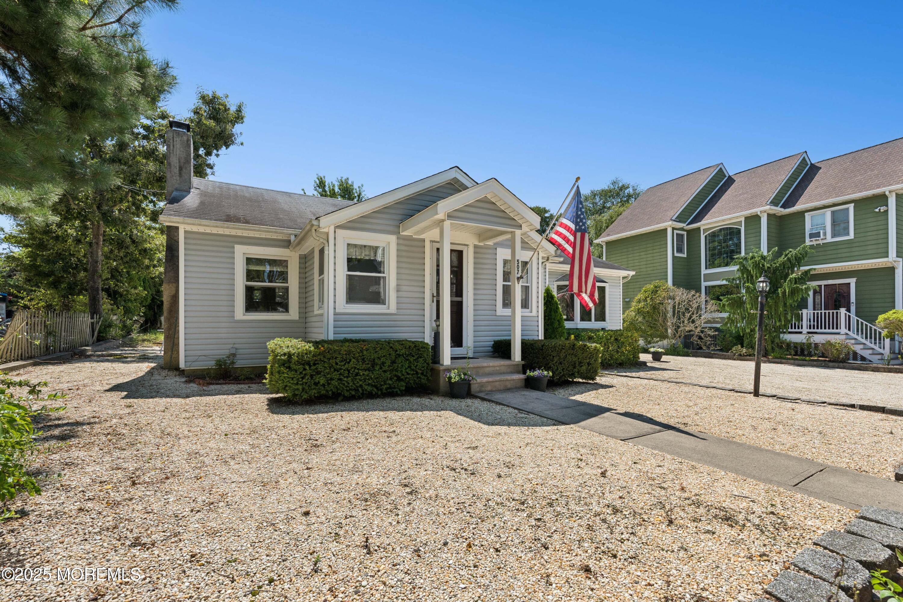 507 Riverside Drive South Brick, NJ 08723 - Photo 4 of 30 a front view of a house with a yard