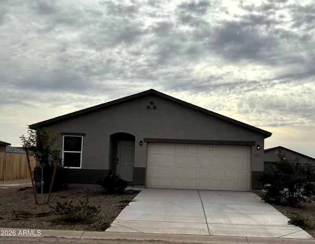 a front view of a house with garage