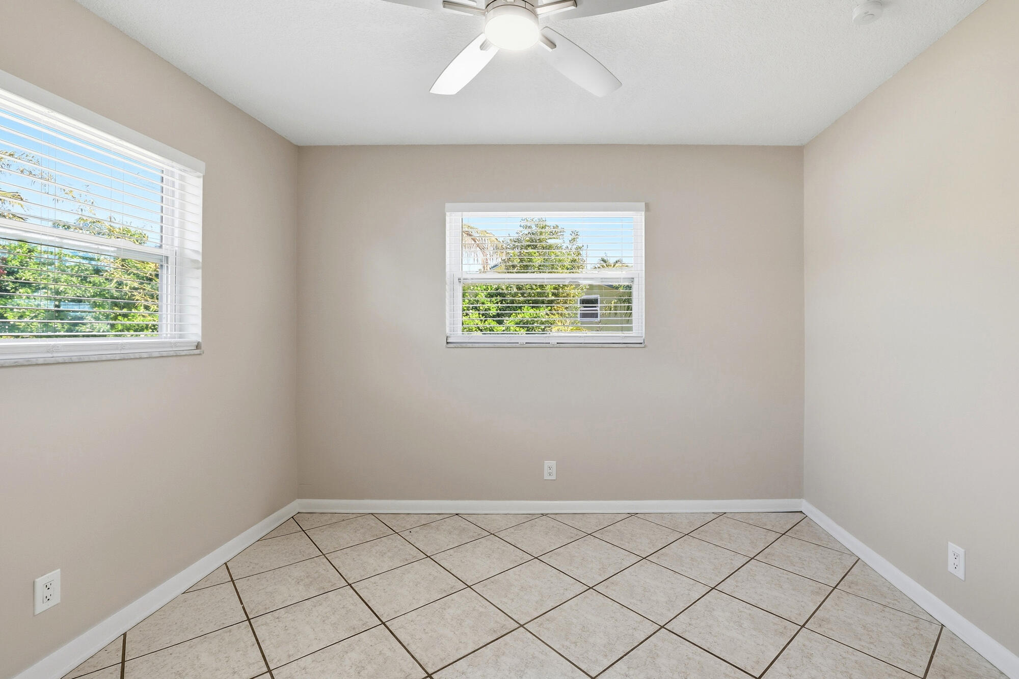 301 Wilma Circle Riviera Beach, FL 33404 - Photo 12 of 35 an empty room with a window