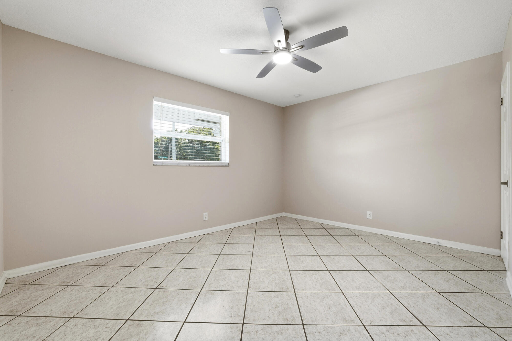 301 Wilma Circle Riviera Beach, FL 33404 - Photo 14 of 35 a view of an empty room with a window