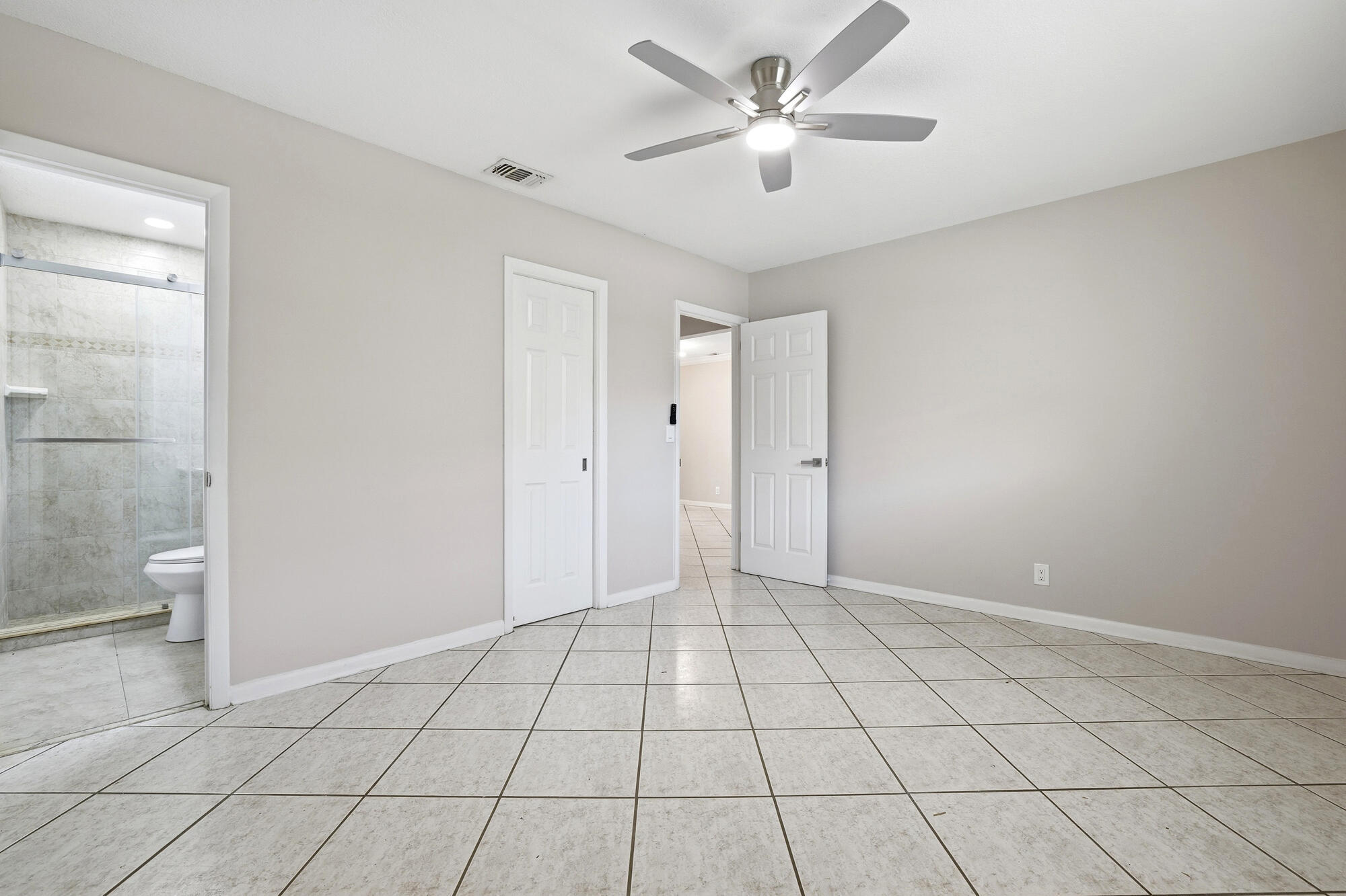 301 Wilma Circle Riviera Beach, FL 33404 - Photo 15 of 35 a view of an empty room and a bathroom