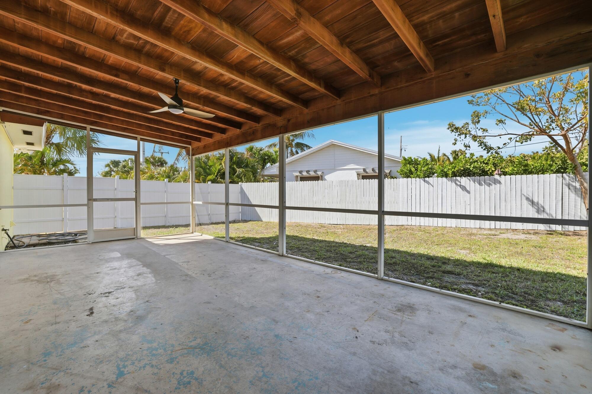 301 Wilma Circle Riviera Beach, FL 33404 - Photo 18 of 35 a view of a backyard
