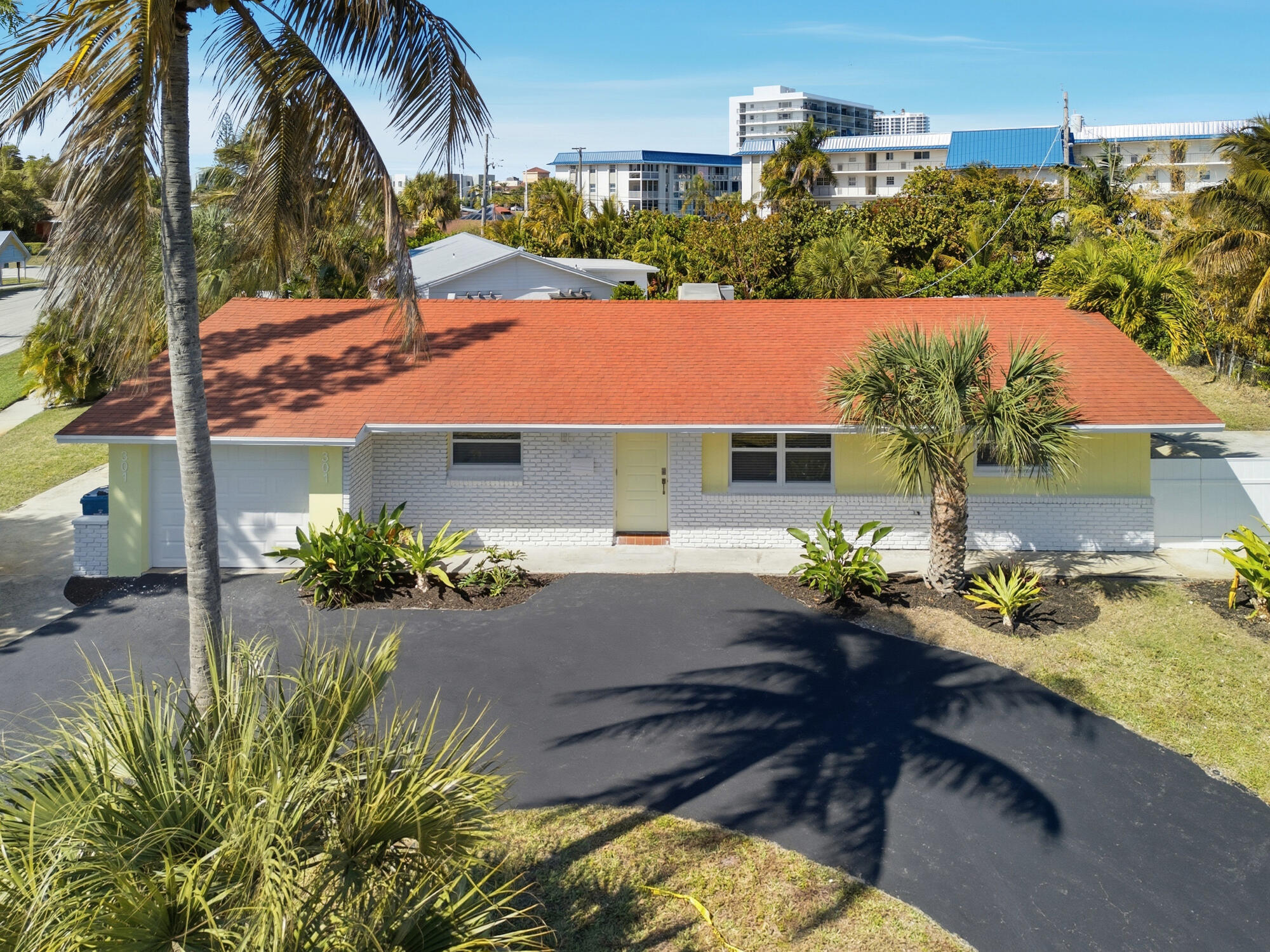 301 Wilma Circle Riviera Beach, FL 33404 - Photo 2 of 35 a view of house with swimming pool and sitting area