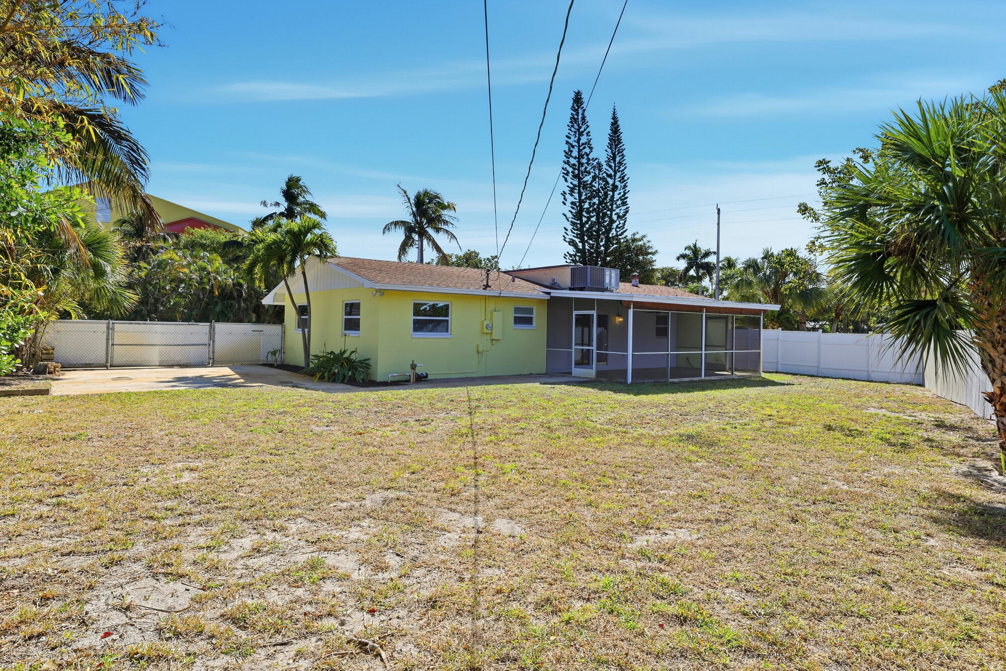 301 Wilma Circle Riviera Beach, FL 33404 - Photo 22 of 35 a front view of a house with a yard