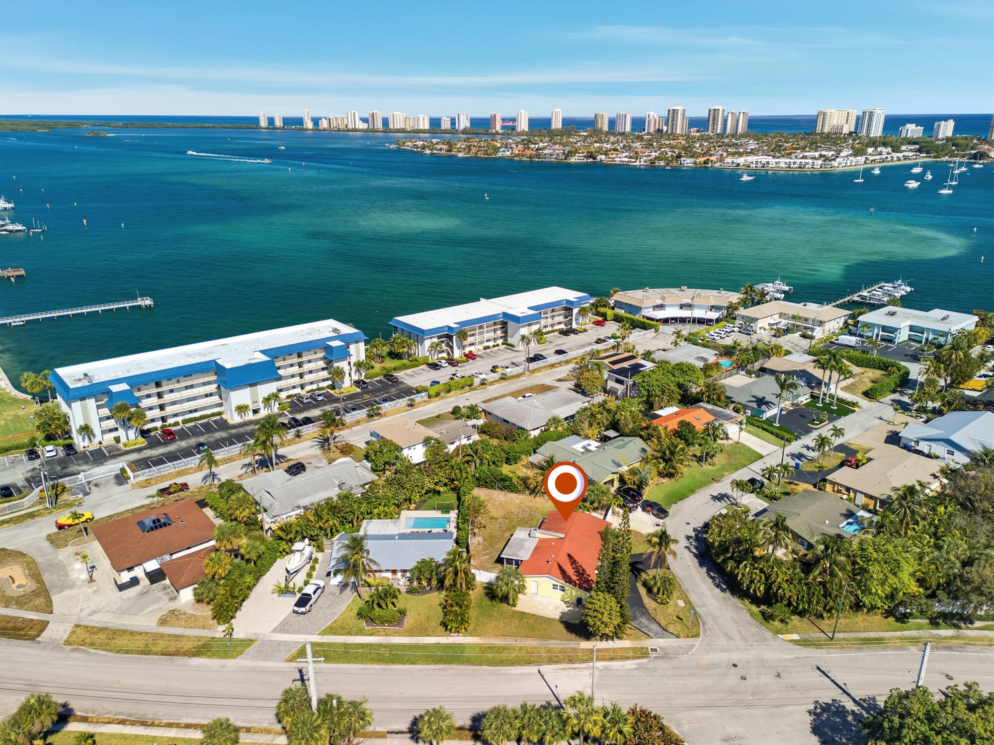301 Wilma Circle Riviera Beach, FL 33404 - Photo 23 of 35 a view of a lake with a big yard