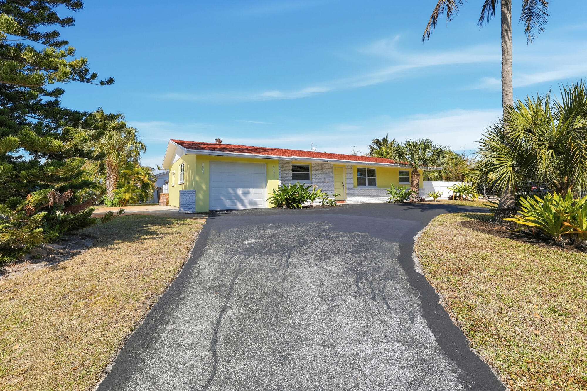 301 Wilma Circle Riviera Beach, FL 33404 - Photo 3 of 35 a view of a house with a yard